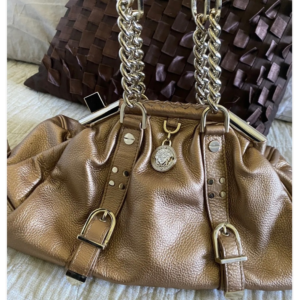 Versace gorgeous Medusa gold leather see pictures please. Price Firm.